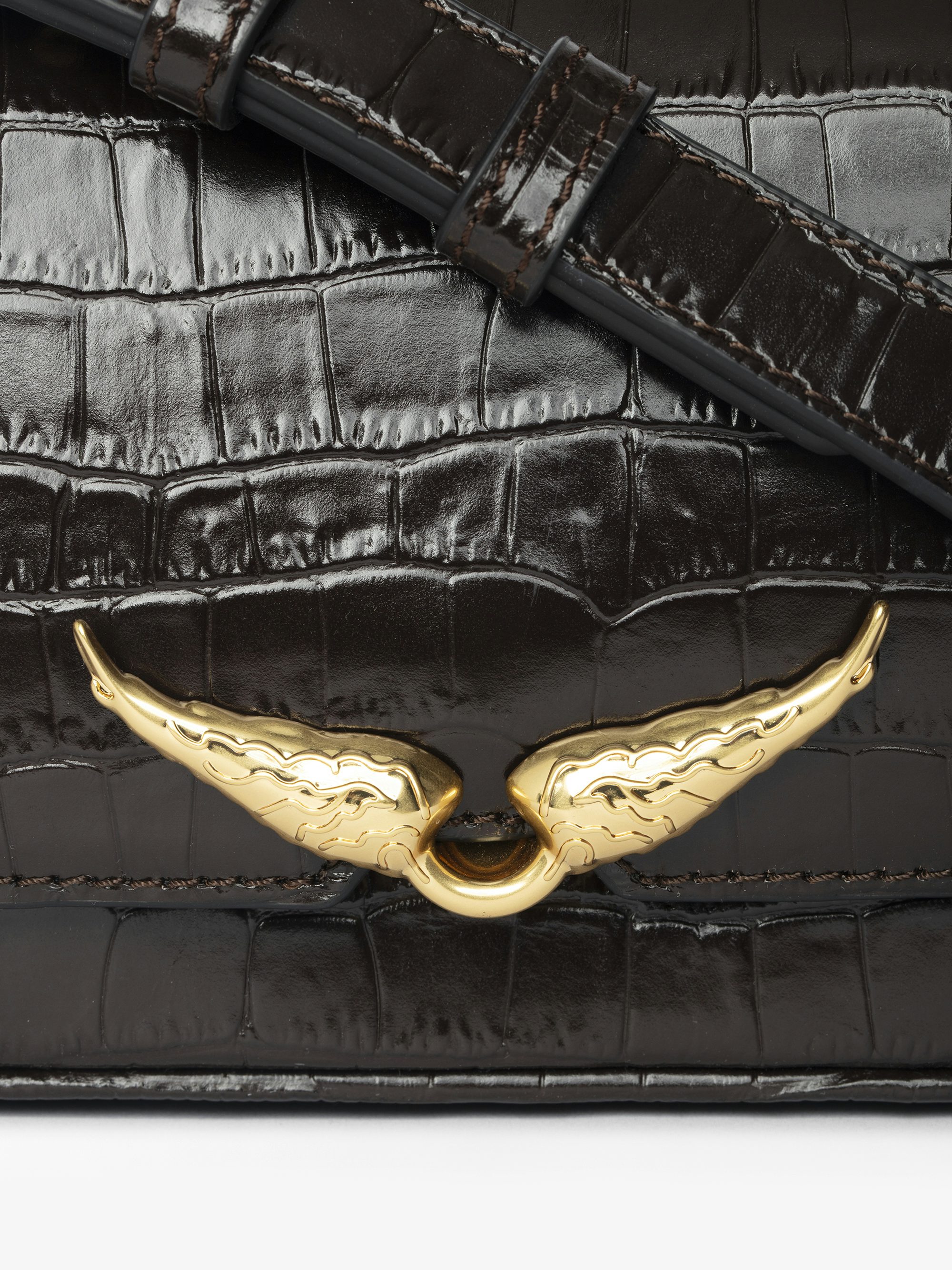 Le Zazi Croco Bag - Small croco-effect leather bag with adjustable shoulder strap and signature wings.
